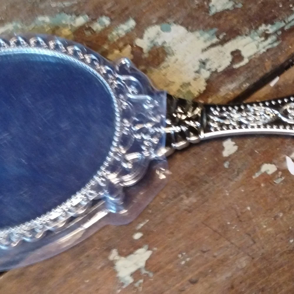plastic handheld silver colored mirror